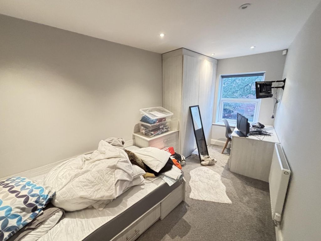 Property photo 3 of 6 A Cozy Bedroom With A Single Bed, A Desk, And A Wi...