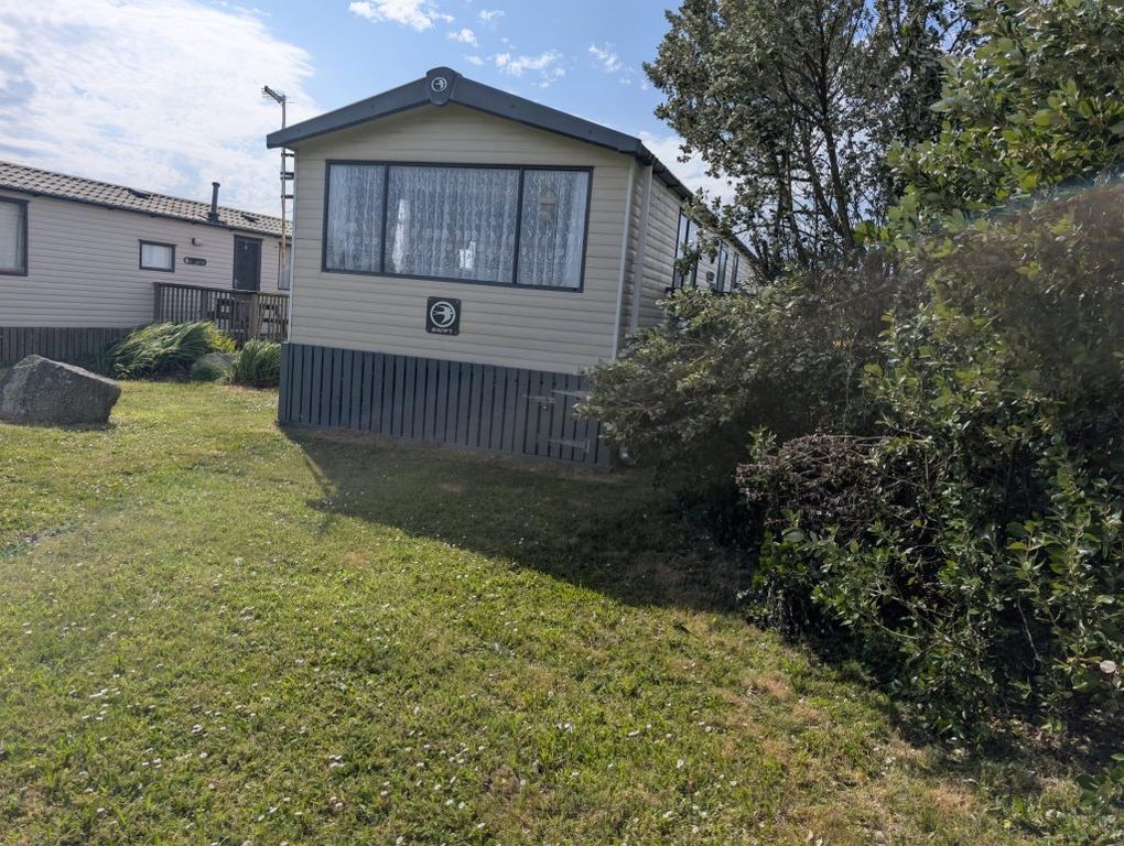Property photo 2 of 12 Exterior Of The Swift Family Retreat Holiday Caravan On Its Grassy Plot