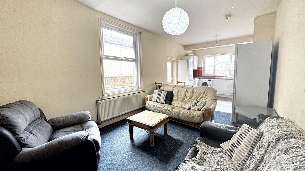 Property photo 1 of 9 A Bright And Spacious Living Room Featuring Comfor...