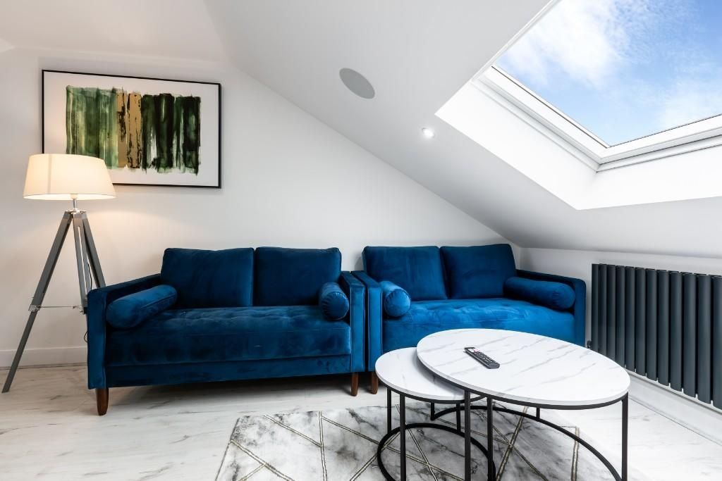 Property photo 3 of 10 A Bright And Modern Living Room Featuring A Comfor...