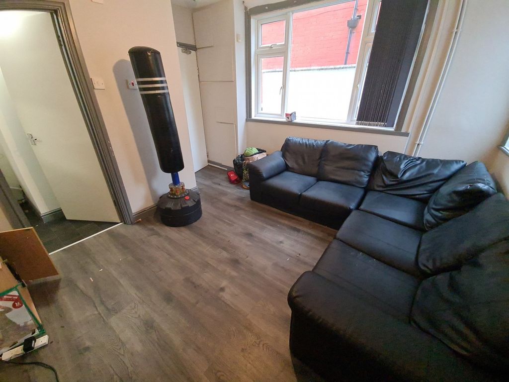 Property photo 3 of 16 A Spacious And Comfortable Living Room With A Mode...