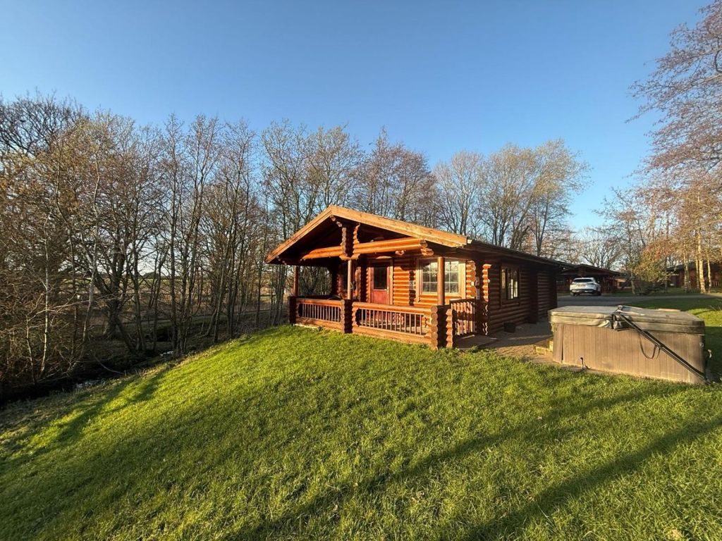 Property photo 1 of 7 Bespoke Log Cabin Exterior With Private Hot Tub And Driveway