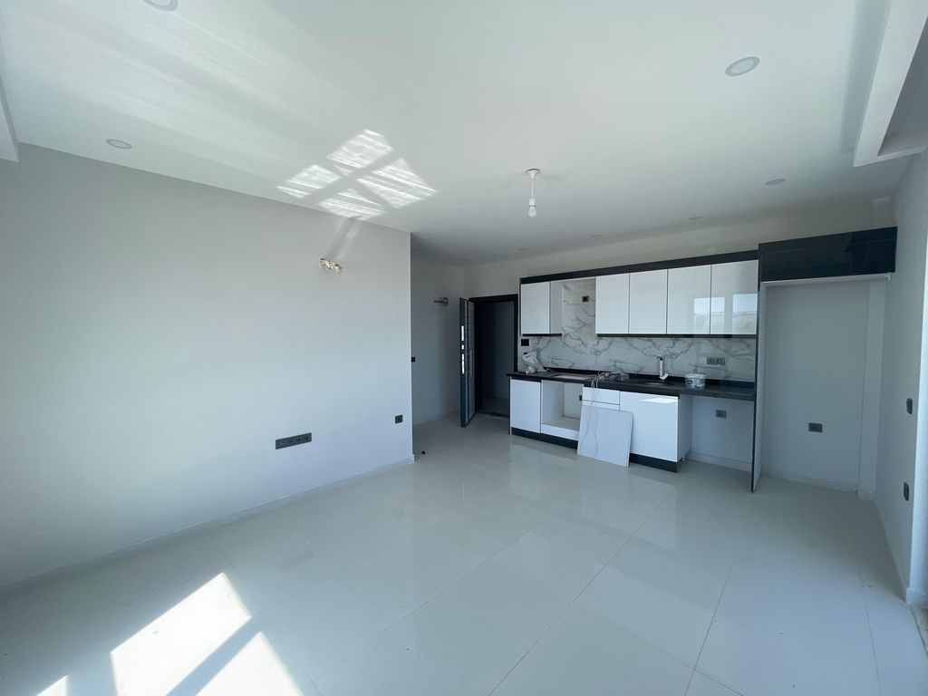 Property photo 2 of 10 Newly-Built Sea View Alanya Apartment For Sale €“ Modern Open-Plan Living Room