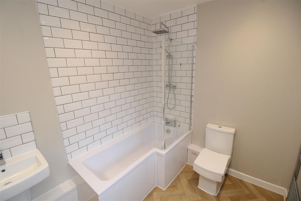 Property photo 1 of 28 Modern Bathroom With Sleek Tiles And Large Bath...