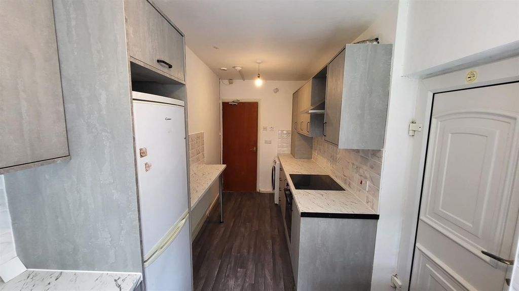 Property photo 3 of 9 Bright And Functional Kitchen Featuring Modern App...