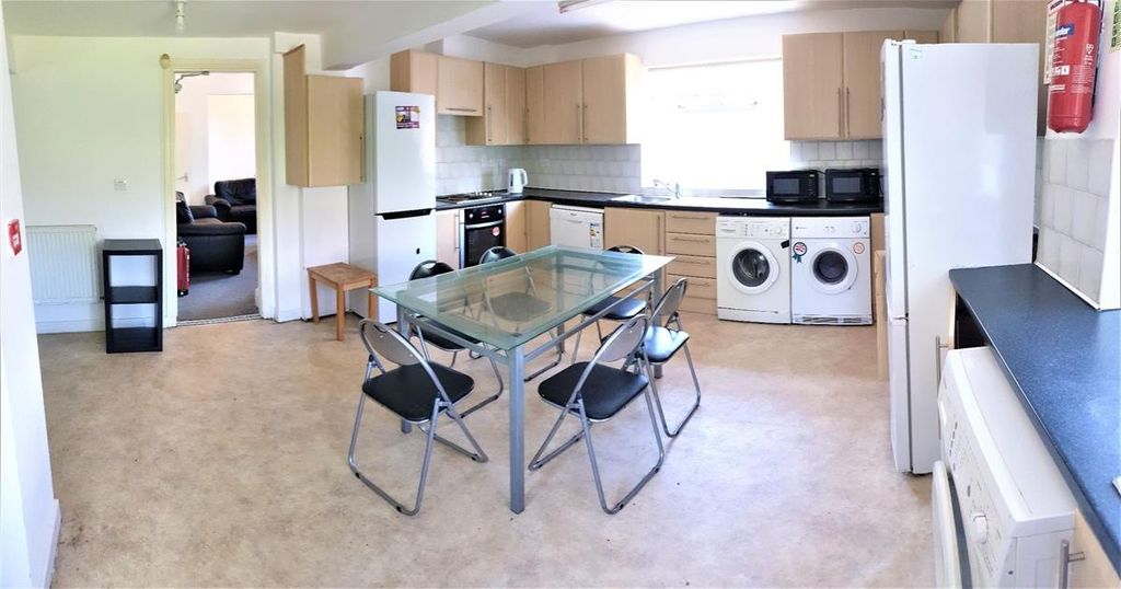 Property photo 2 of 15 Bright Open-Plan Kitchen With Light Wood Cabinetry...