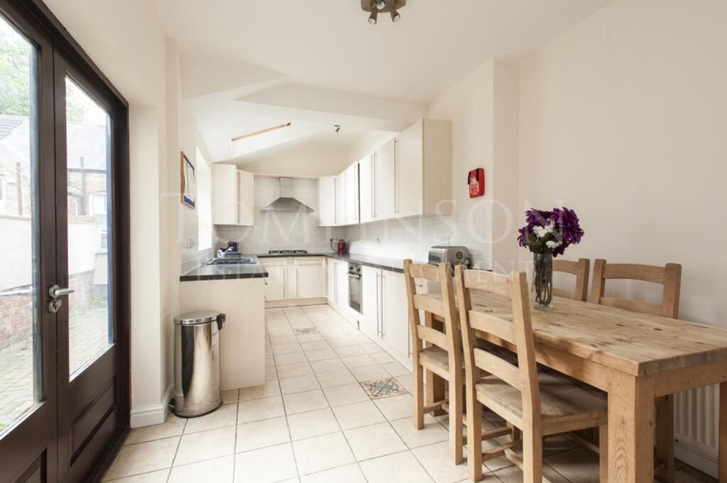 Property photo 3 of 9 A Spacious And Inviting Kitchen With Modern Applia...
