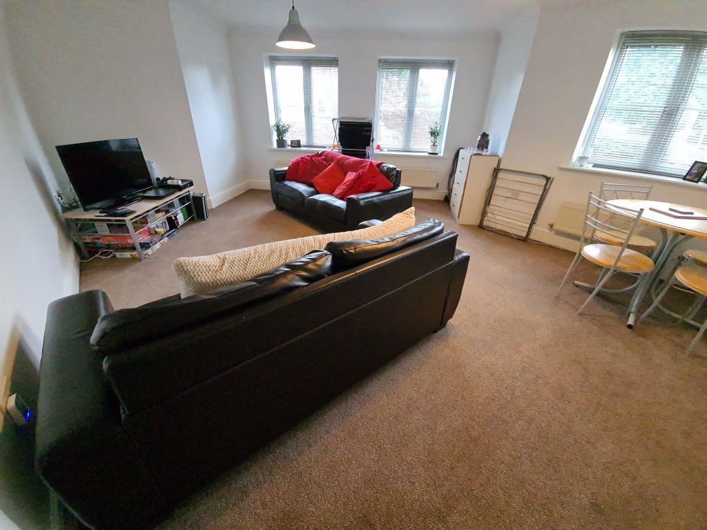 Property photo 2 of 28 Bright And Spacious Living Room Featuring Two Larg...