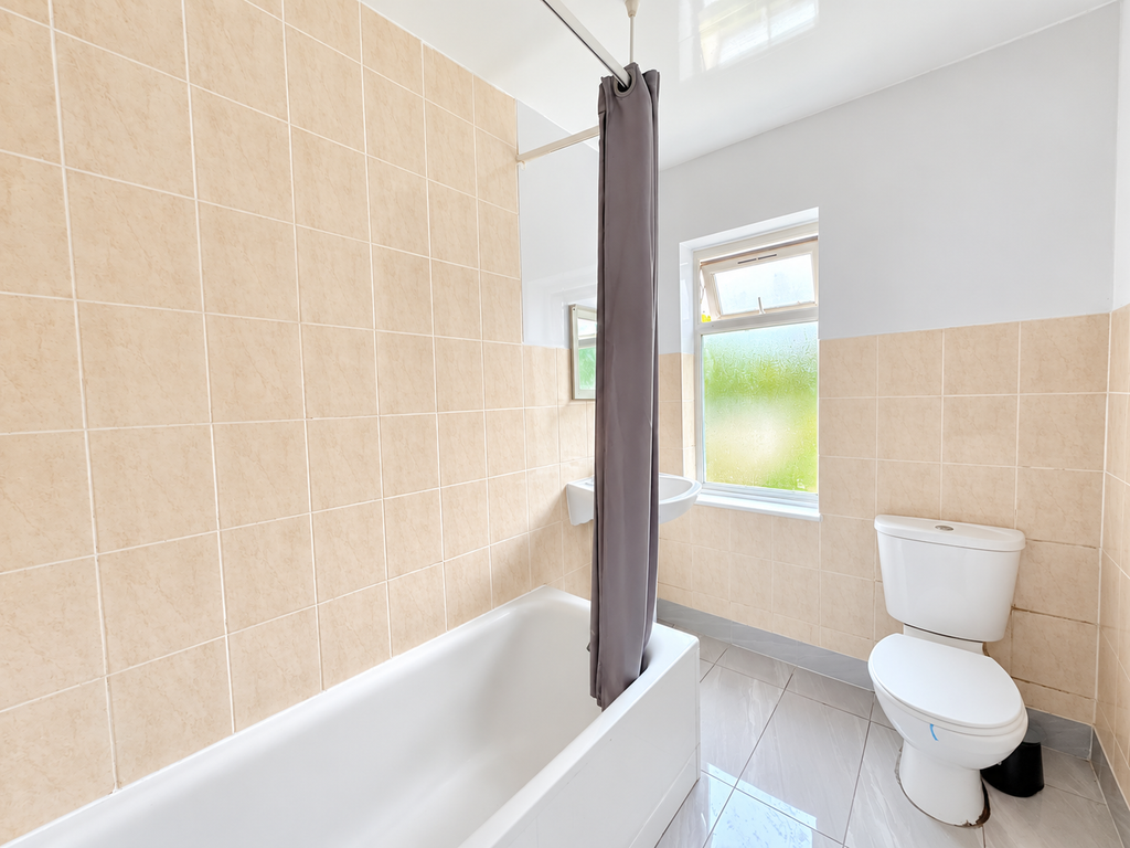 Property photo 3 of 10 Bright Neutral Bathroom With Gray Shower Curtain