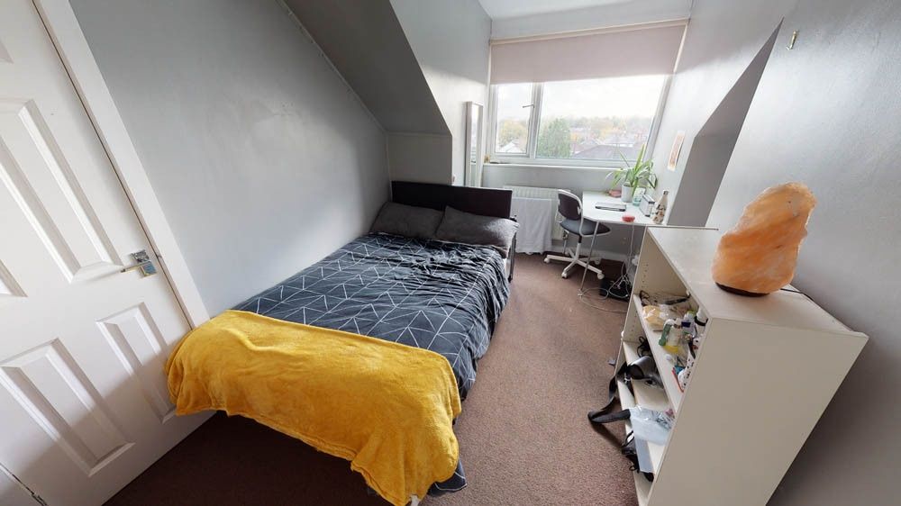 Property photo 3 of 6 A Cozy Single Bedroom Featuring A Neatly Made Bed ...