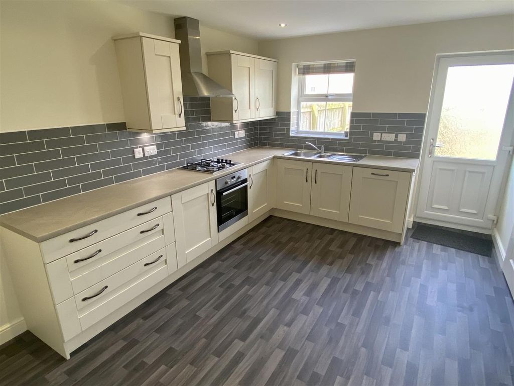 Property photo 2 of 8 Modern Kitchen With Sleek Grey Tiling And Space...