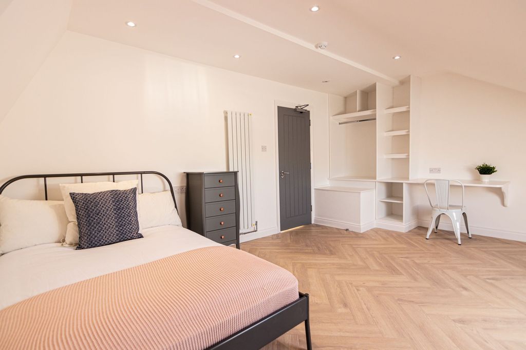 Property photo 3 of 15 A Bright And Welcoming Bedroom Featuring A Modern ...