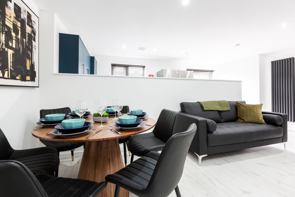 Property photo 1 of 4 Modern And Stylish Living Room Featuring A Cozy So...