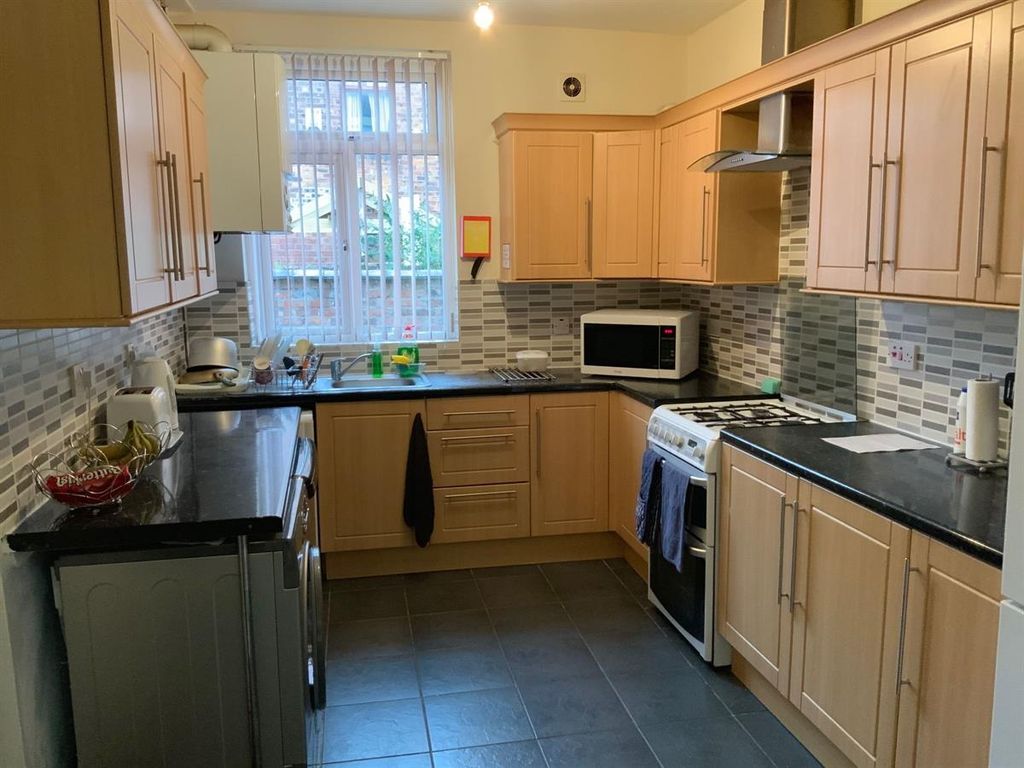 Property photo 3 of 8 Bright Kitchen With Ample Storage And Workspace...