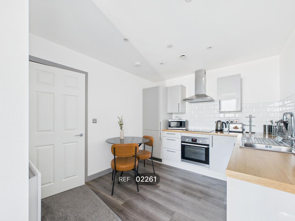 Property photo 2 of 12 Kitchen & Living Area