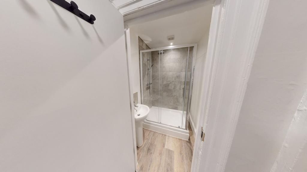 Property photo 1 of 22 A Modern And Clean Bathroom Featuring A Sleek Show...