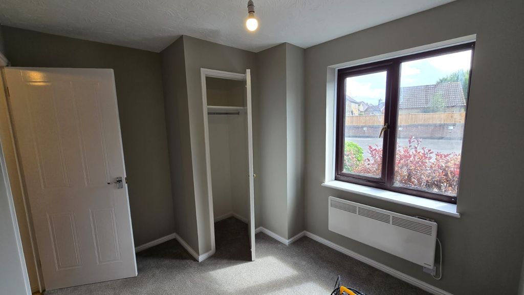 Property photo 2 of 8 A Bright And Tidy Bedroom Featuring A Large Window...
