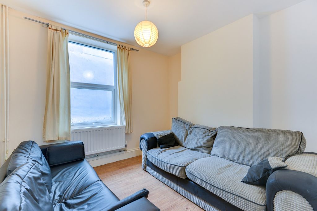 Property photo 1 of 19 Bright And Welcoming Living Room With Large Window...