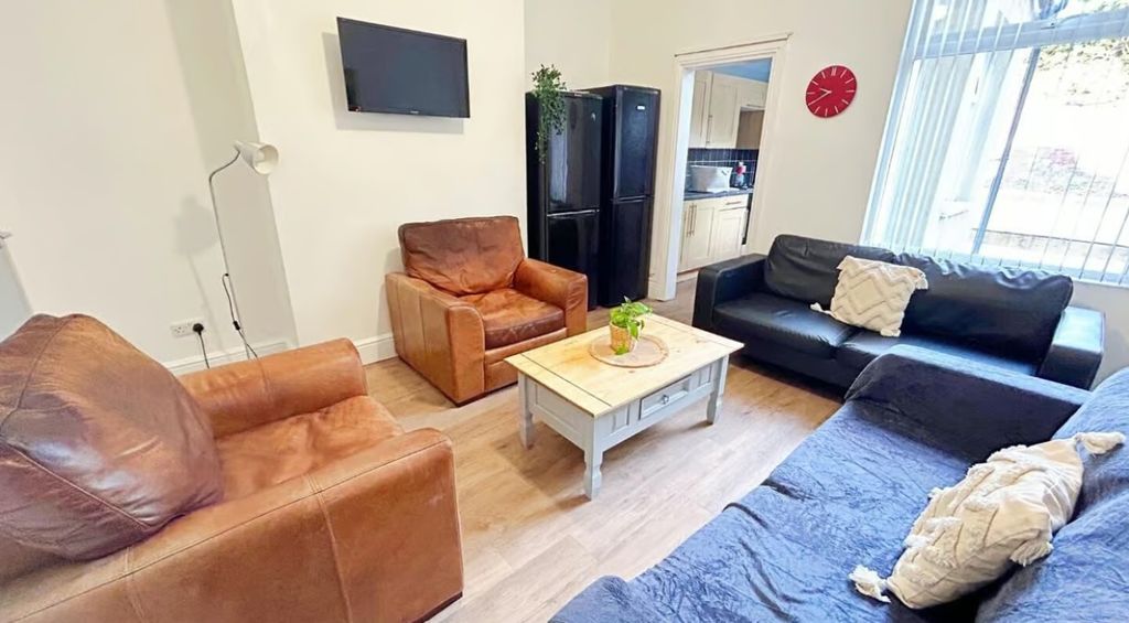 Property photo 3 of 10 This Inviting Living Room Features Comfortable Sea...