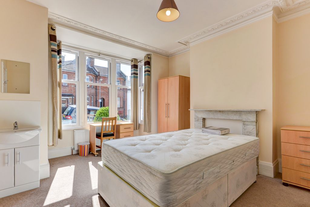 Property photo 1 of 14 Bright And Welcoming Bedroom Featuring A Large Win...