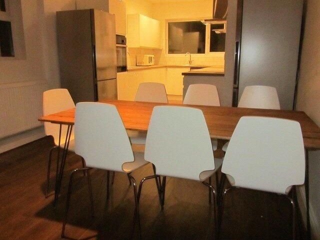 Property photo 3 of 10 A Modern Kitchen With A Large Wooden Dining Table ...