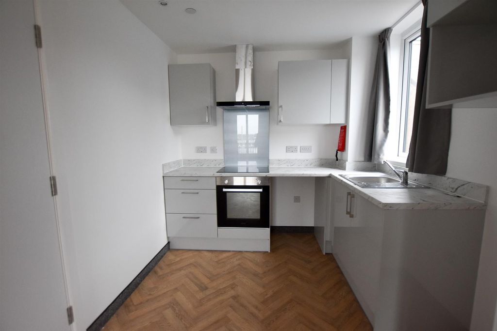 Property photo 3 of 12 Kitchen Area