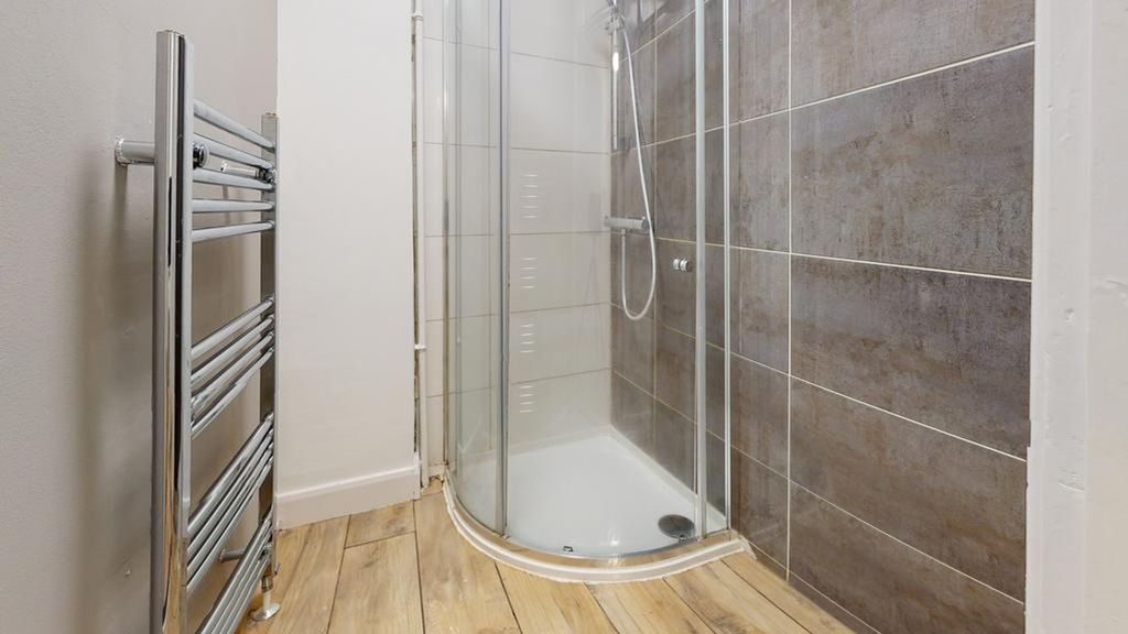 Property photo 1 of 9 A Modern And Clean Bathroom Featuring A Stylish Sh...