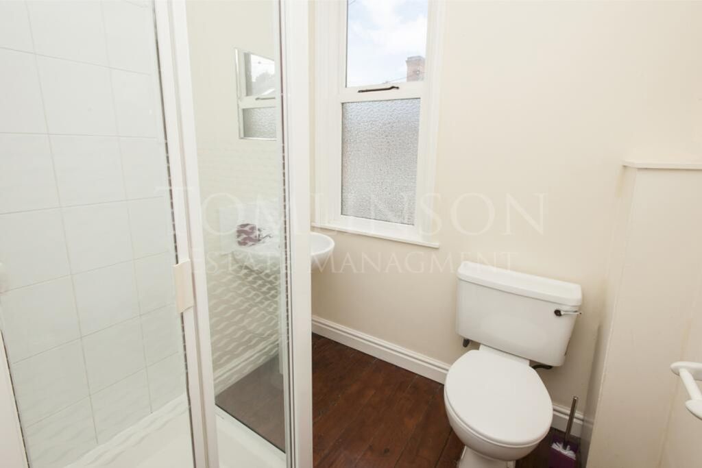 Property photo 1 of 9 A Bright And Tidy Bathroom Featuring A Shower, Per...