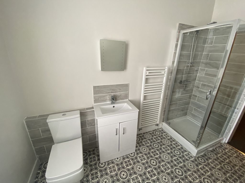 Property photo 2 of 13 This Modern Bathroom Features A Sleek Design With ...