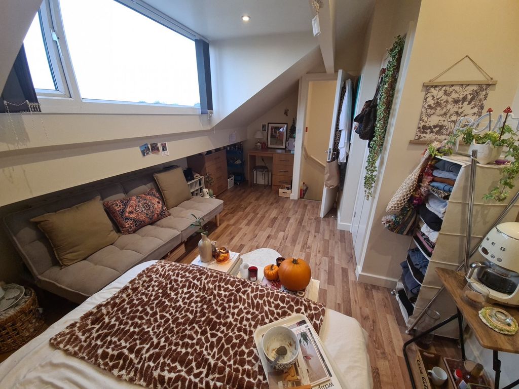 Property photo 1 of 14 A Cozy And Welcoming Living Room Filled With Natur...