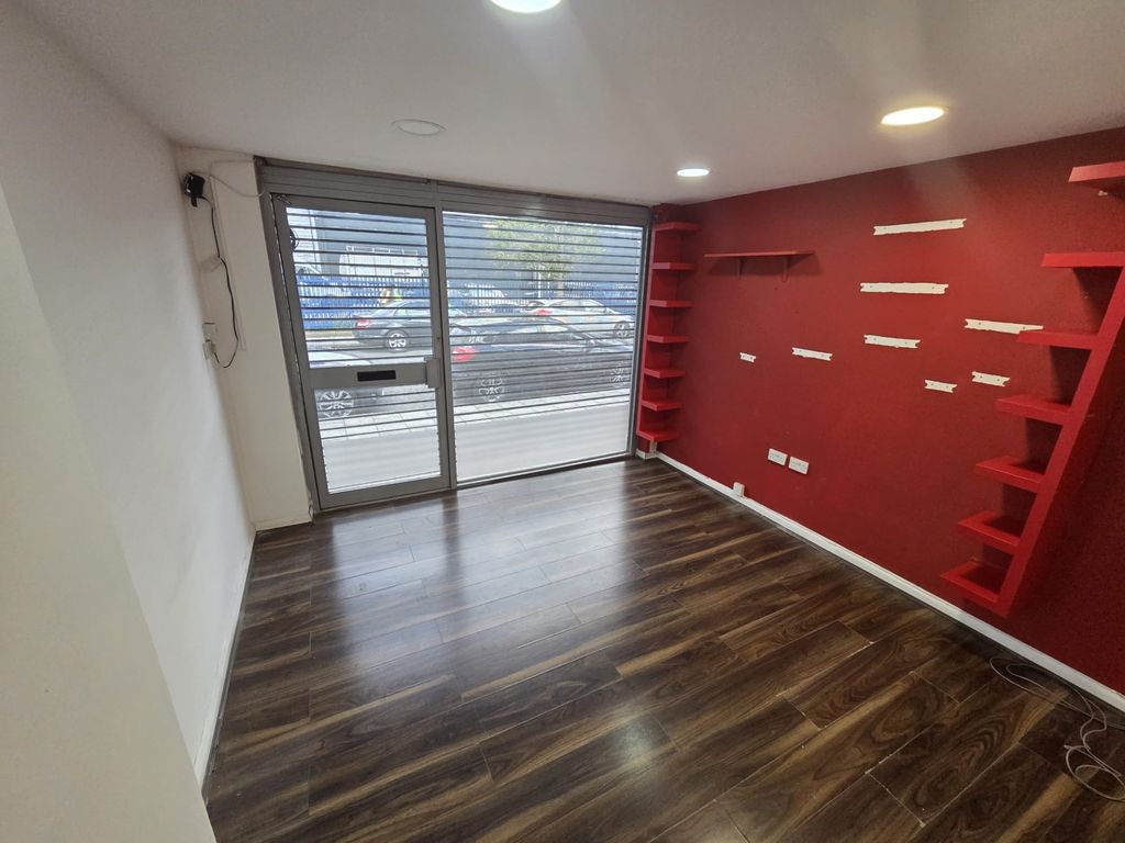 Property photo 1 of 8 Modern Entrance With Wood Flooring And Red Decor S...