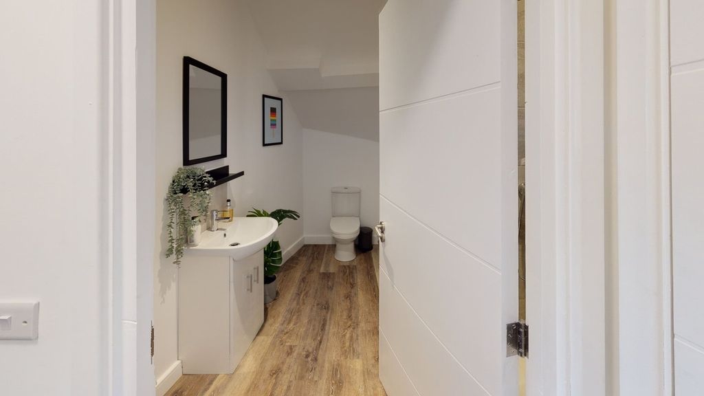Property photo 1 of 13 A Modern And Clean Bathroom Featuring Stylish Fixt...