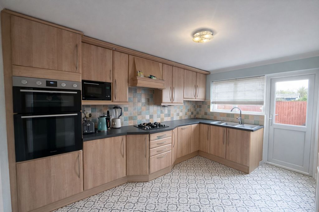 Property photo 2 of 11 Kitchen Area