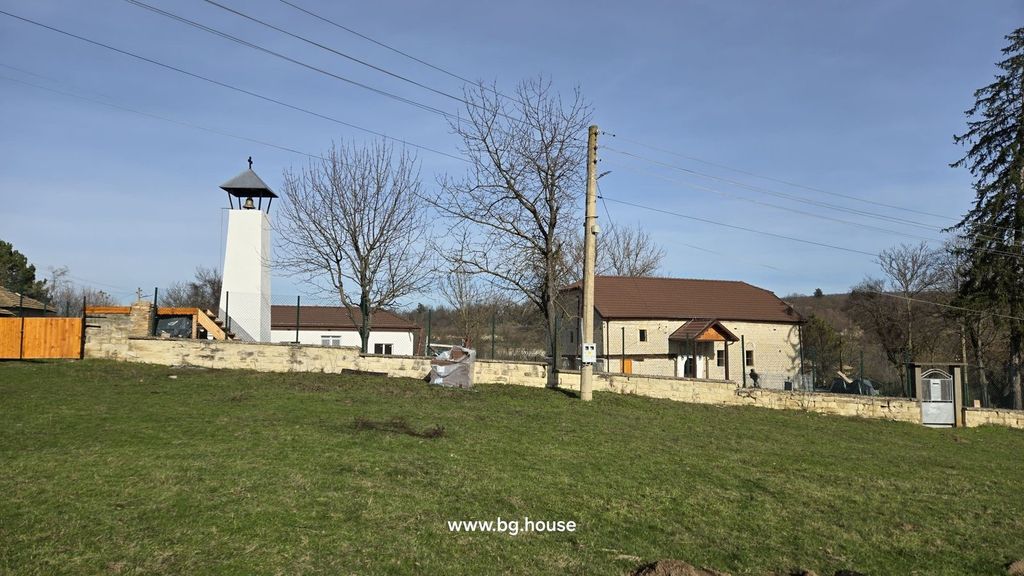 Property photo 2 of 79 View Of A White Bell Tower And A Fenced House Situated On A Grassy Hill With Trees Around.