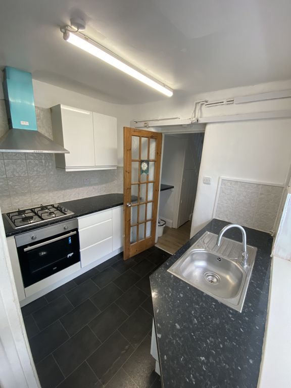 Property photo 1 of 6 A Modern Kitchen Featuring Sleek Cabinetry And Amp...
