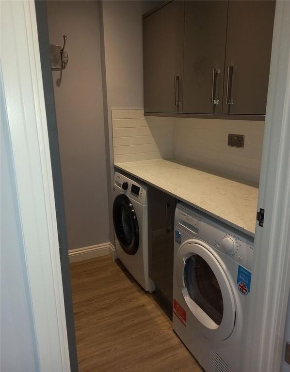 Property photo 2 of 10 A Neat And Well-Organized Utility Room Featuring A...