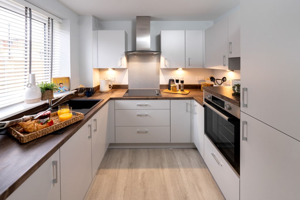Property photo 3 of 11 Typical Kitchen