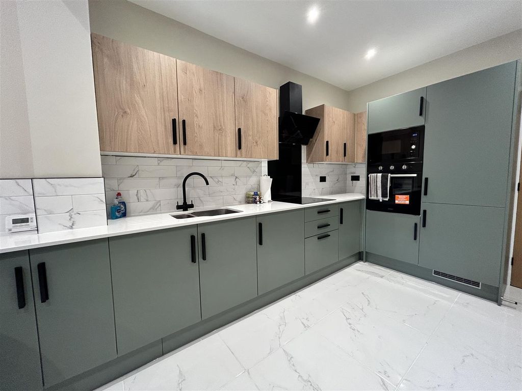 Property photo 2 of 16 Kitchen Area