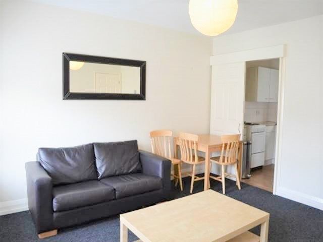 Property photo 2 of 5 A Bright And Tidy Living Room Featuring A Comforta...