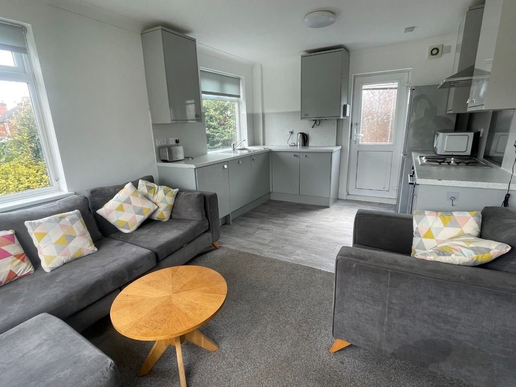 Property photo 3 of 13 Bright And Inviting Living Room With Modern Furnis...