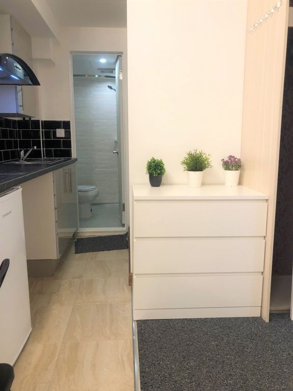 Property photo 3 of 9 A Compact And Tidy Kitchenette Area With Modern Bl...