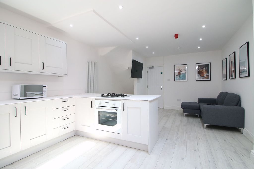 Property photo 1 of 6 Bright And Modern Living Area Featuring A Sleek Gr...