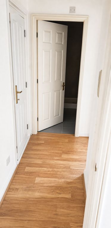 Property photo 2 of 7 Bright Hallway With Stylish Wood-Effect Flooring...