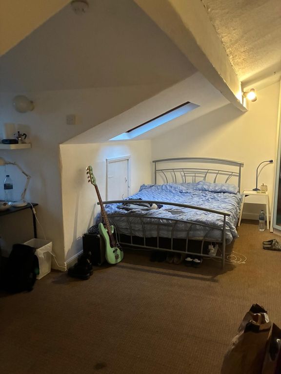 Property photo 3 of 4 Charming Attic Bedroom With Skylight And Desk...
