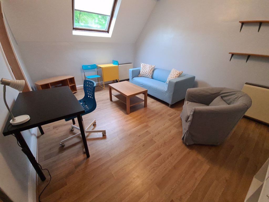 Property photo 2 of 7 Bright And Cozy Living Room Featuring A Skylight W...