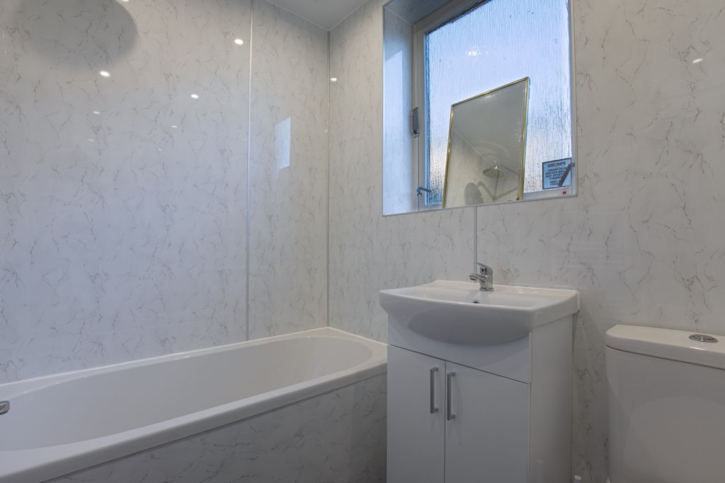 Property photo 3 of 11 Downstairsbathroom