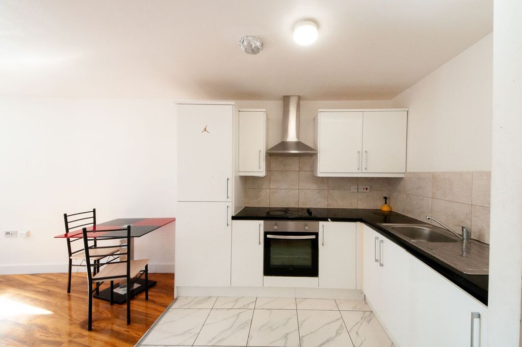 Property photo 2 of 5 Kitchen + Dining Table