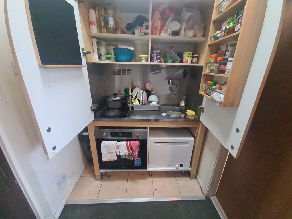 Property photo 1 of 3 Compact And Well-Organized Kitchen With Ample Shel...