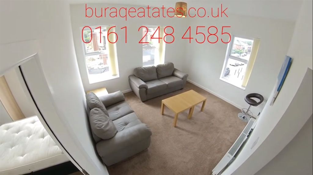 Property photo 1 of 13 Bright And Inviting Living Room Featuring Modern S...