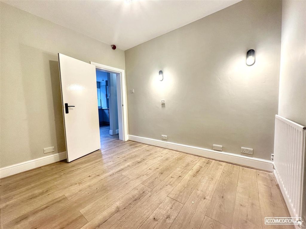 Property photo 3 of 9 Bright, Neutral Bedroom With Wood Flooring...